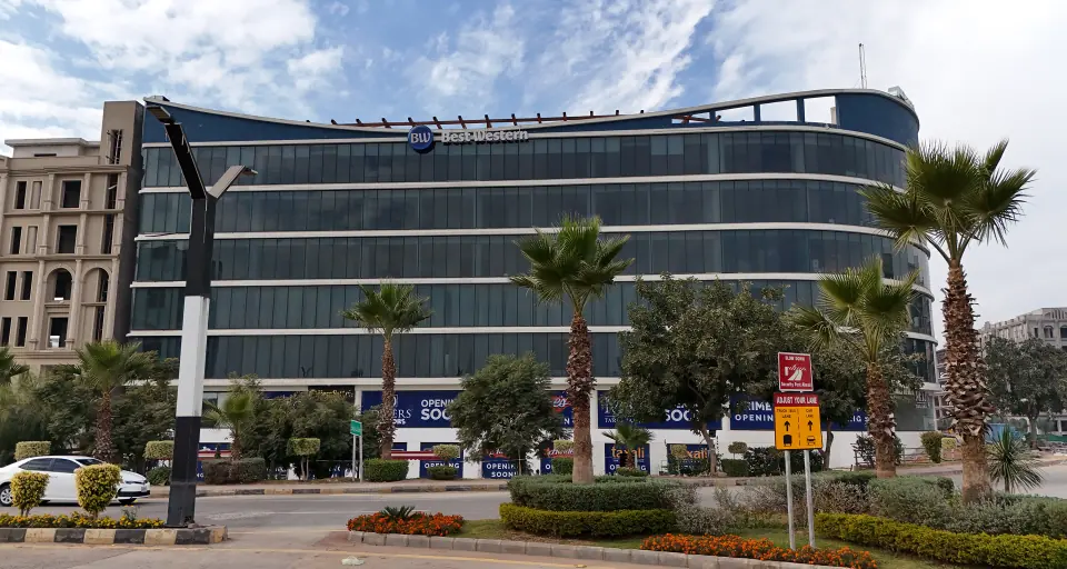 Melrose Arch building with palm-lined boulevard