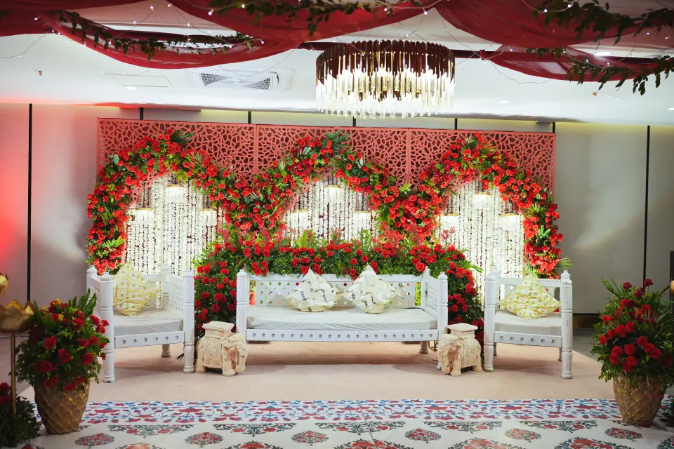 Red and white floral wedding stage at Melrose Arch