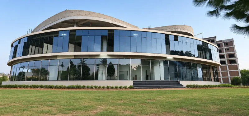 Sky Luxe curved glass facade seen from the front lawn, September 2026